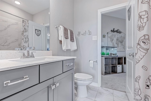 bathroom with baseboards, a shower with shower curtain, toilet, vanity, and marble finish floor