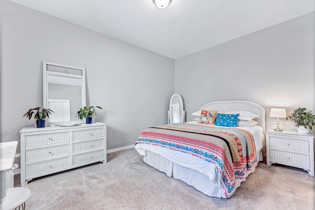 bedroom featuring baseboards and carpet floors