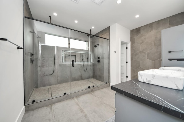 5327 S Braeswood Blvd, Houston, TX 77096 - bathroom with recessed lighting, a stall shower, tile walls, and vanity