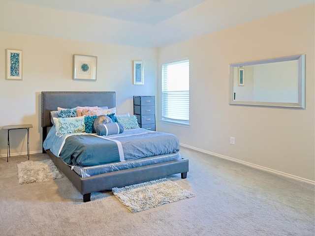 carpeted bedroom with baseboards