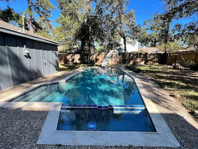 602 Rosewood Dr, Shenandoah, TX 77381 - view of pool featuring a water slide, a fenced backyard, and a pool with connected hot tub
