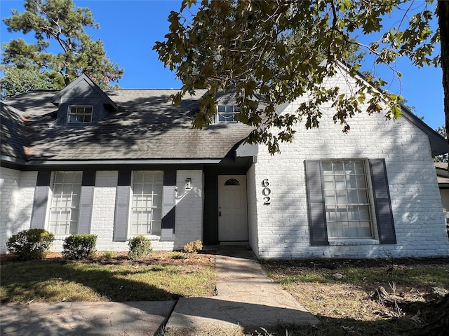 602 Rosewood Dr, Shenandoah, TX 77381 - view of front of property with brick siding and roof with shingles