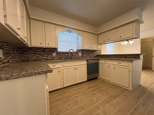 602 Rosewood Dr, Shenandoah, TX 77381 - kitchen featuring dishwasher, a peninsula, decorative backsplash, and light wood-style floors