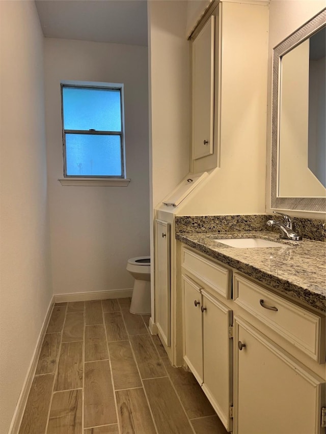 602 Rosewood Dr, Shenandoah, TX 77381 - bathroom with toilet, vanity, and baseboards