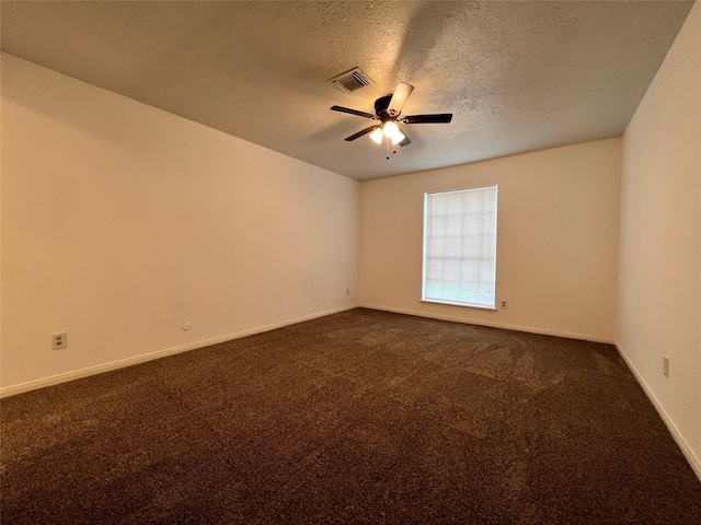 602 Rosewood Dr, Shenandoah, TX 77381 - unfurnished room with ceiling fan, dark carpet, baseboards, and a textured ceiling
