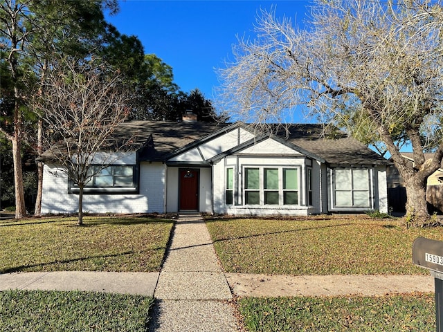 15903 Brookvilla Dr, Houston, TX 77059 - ranch-style home featuring a chimney, a front lawn, and brick siding