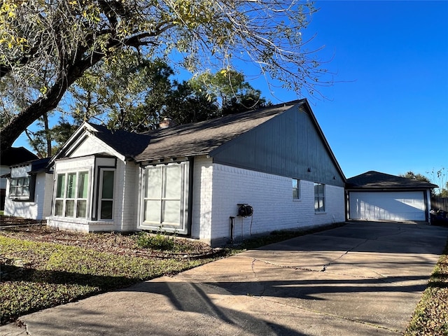 15903 Brookvilla Dr, Houston, TX 77059 - view of home's exterior with brick siding, a chimney, a garage, and an outbuilding