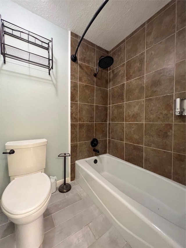 15903 Brookvilla Dr, Houston, TX 77059 - full bathroom featuring baseboards, toilet, a textured ceiling, bathtub / shower combination, and tile patterned flooring