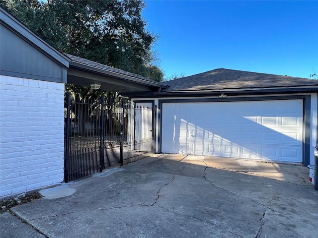 15903 Brookvilla Dr, Houston, TX 77059 - garage with driveway, fence, and a gate