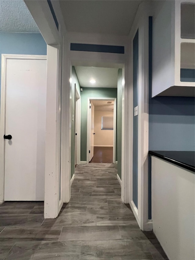 15903 Brookvilla Dr, Houston, TX 77059 - corridor with baseboards and wood finished floors