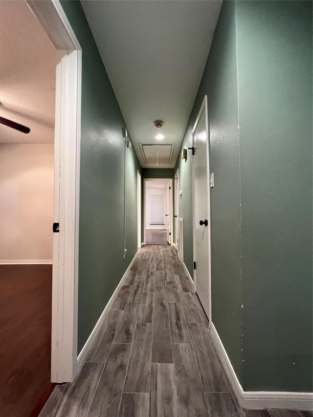 15903 Brookvilla Dr, Houston, TX 77059 - hall with baseboards, attic access, and wood finished floors