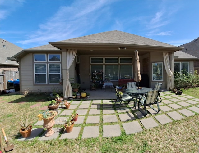 3210 Vintage View Ln, Pearland, TX 77584 - rear view of house featuring a patio, a lawn, and roof with shingles