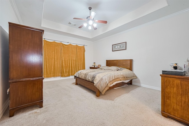 bedroom featuring a raised ceiling, carpet flooring, baseboards, and visible vents