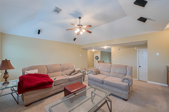 living room with baseboards, vaulted ceiling, visible vents, ceiling fan, and light colored carpet