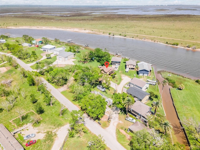 bird's eye view with a water view and a residential view