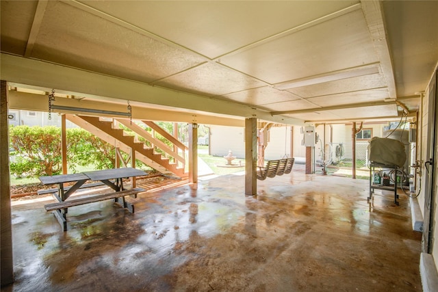 view of patio featuring stairway and electric panel