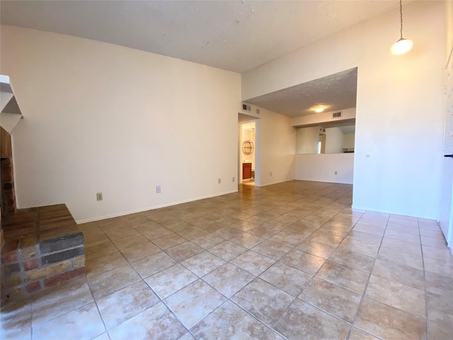 10555 Turtlewood Ct Unit 903, Houston, TX 77072 - unfurnished living room with visible vents and tile patterned floors