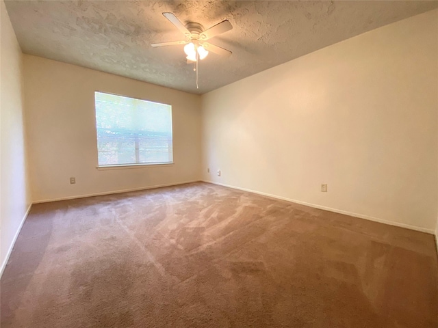 10555 Turtlewood Ct Unit 903, Houston, TX 77072 - carpeted spare room with a textured ceiling, ceiling fan, and baseboards