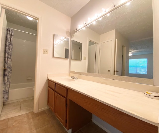 10555 Turtlewood Ct Unit 903, Houston, TX 77072 - full bathroom with vanity, baseboards, tile patterned floors, a textured ceiling, and shower / bath combo with shower curtain