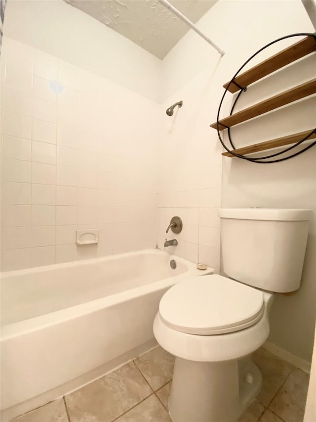 10555 Turtlewood Ct Unit 903, Houston, TX 77072 - bathroom featuring washtub / shower combination, toilet, and tile patterned floors