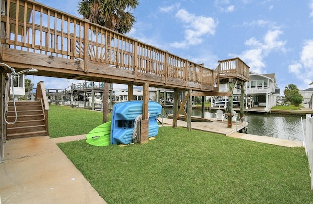 21831 Frio Dr, Galveston, TX 77554 - dock area with a water view, stairs, and a lawn