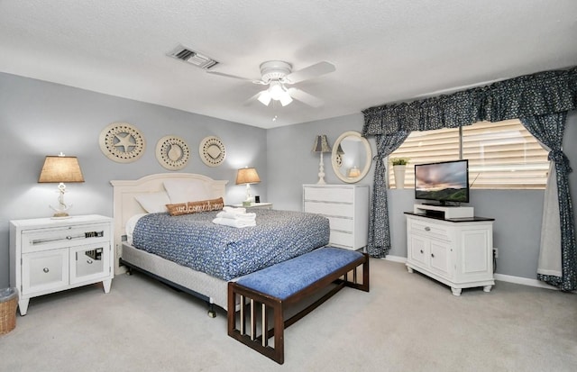 21831 Frio Dr, Galveston, TX 77554 - bedroom with visible vents, baseboards, a ceiling fan, and light carpet