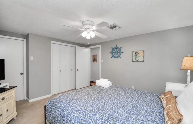 21831 Frio Dr, Galveston, TX 77554 - bedroom featuring a closet, visible vents, light colored carpet, and ceiling fan