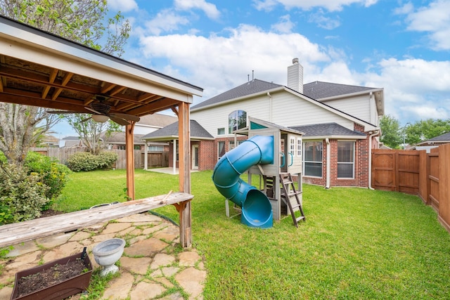 24807 Mason Trail Dr, Katy, TX 77493 - view of playground with a fenced backyard and a lawn
