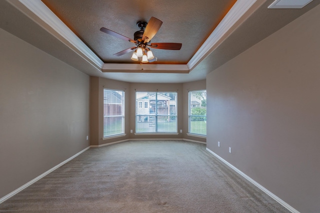 24807 Mason Trail Dr, Katy, TX 77493 - empty room with visible vents, a tray ceiling, baseboards, and carpet floors