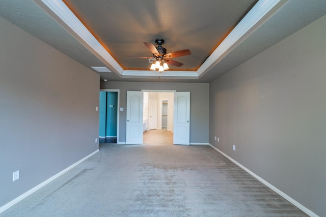 24807 Mason Trail Dr, Katy, TX 77493 - unfurnished bedroom featuring a tray ceiling, crown molding, baseboards, and carpet