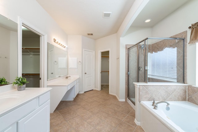 24807 Mason Trail Dr, Katy, TX 77493 - bathroom with two vanities, visible vents, a sink, and a stall shower