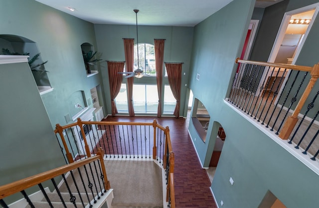 24807 Mason Trail Dr, Katy, TX 77493 - staircase with wood finished floors, a high ceiling, and a ceiling fan