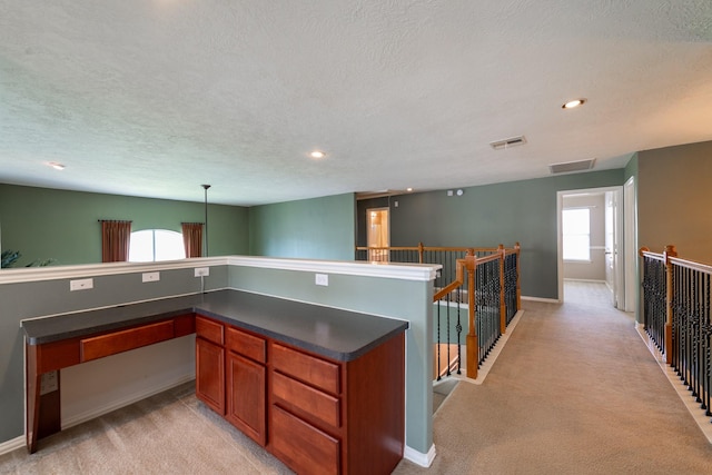 24807 Mason Trail Dr, Katy, TX 77493 - kitchen with light carpet, dark countertops, visible vents, and a textured ceiling