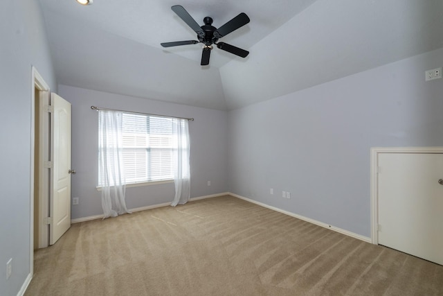 24807 Mason Trail Dr, Katy, TX 77493 - empty room featuring baseboards, light colored carpet, vaulted ceiling, and a ceiling fan