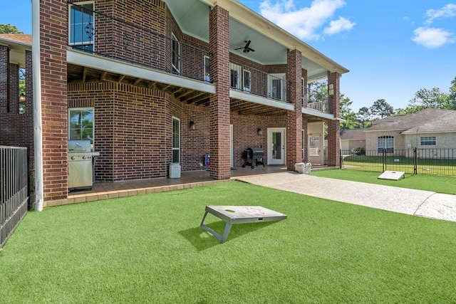 2906 Penninsula Pt, Montgomery, TX 77356 - rear view of property featuring a balcony, brick siding, and a patio