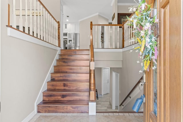 2906 Penninsula Pt, Montgomery, TX 77356 - stairs featuring tile patterned flooring and crown molding