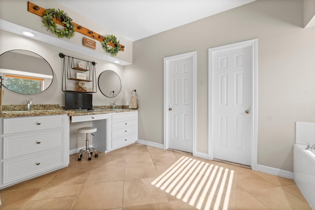 2906 Penninsula Pt, Montgomery, TX 77356 - full bath with double vanity, a tub, and tile patterned floors