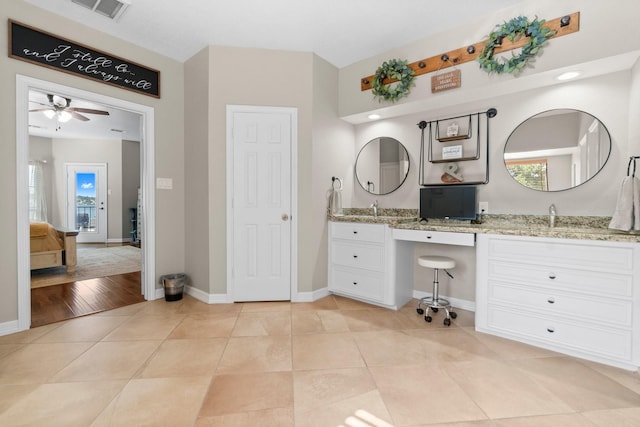 2906 Penninsula Pt, Montgomery, TX 77356 - bathroom featuring double vanity, ceiling fan, plenty of natural light, and tile patterned flooring