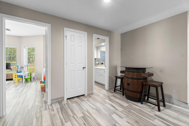 2906 Penninsula Pt, Montgomery, TX 77356 - bedroom with light wood finished floors and ensuite bathroom