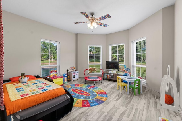 2906 Penninsula Pt, Montgomery, TX 77356 - bedroom with wood finished floors and a ceiling fan