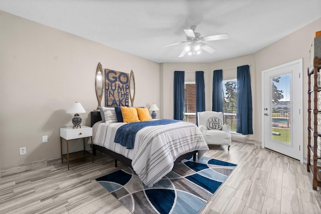 2906 Penninsula Pt, Montgomery, TX 77356 - bedroom with access to outside, light wood-style flooring, and a ceiling fan