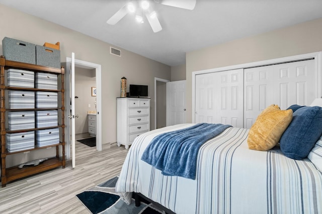 2906 Penninsula Pt, Montgomery, TX 77356 - bedroom featuring light wood-style flooring, a closet, and a ceiling fan