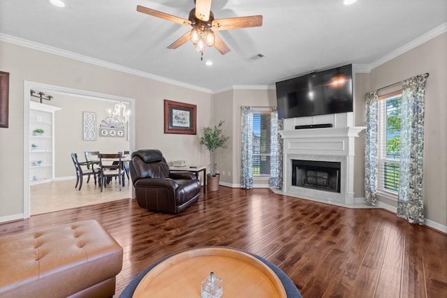 2906 Penninsula Pt, Montgomery, TX 77356 - living area with wood finished floors, a ceiling fan, ornamental molding, recessed lighting, and a fireplace