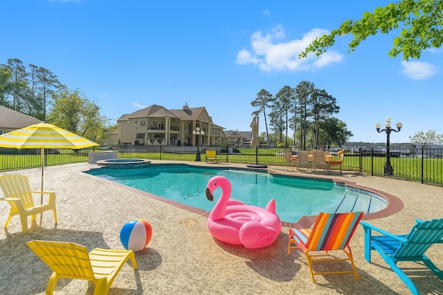 2906 Penninsula Pt, Montgomery, TX 77356 - view of pool with a pool with connected hot tub and a patio