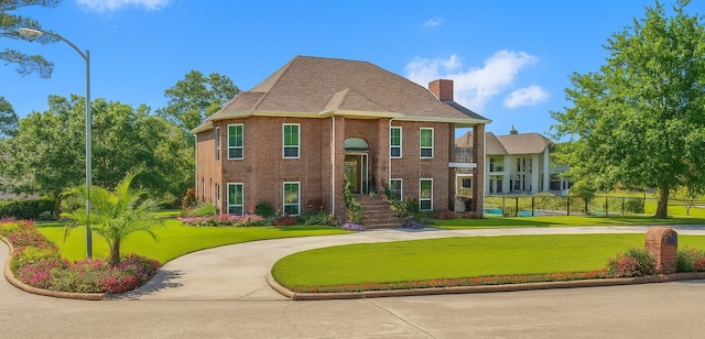 2906 Penninsula Pt, Montgomery, TX 77356 - view of front of property featuring a chimney and brick siding