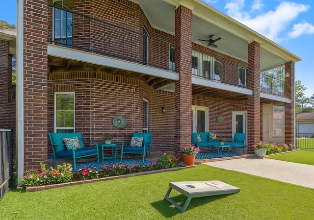 2906 Penninsula Pt, Montgomery, TX 77356 - back of house featuring a balcony, brick siding, an outdoor hangout area, a patio, and ceiling fan