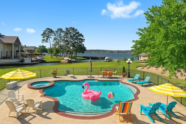 2906 Penninsula Pt, Montgomery, TX 77356 - view of swimming pool featuring a patio area, a water view, and a pool with connected hot tub