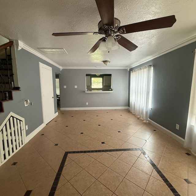 11422 Royal Thistle Ct, Houston, TX 77088 - tiled empty room featuring a textured ceiling, a ceiling fan, inlaid floor details, crown molding, and baseboards