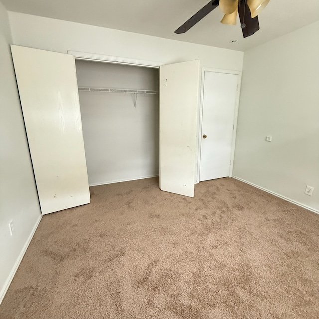 11422 Royal Thistle Ct, Houston, TX 77088 - unfurnished bedroom featuring carpet, a closet, ceiling fan, and baseboards
