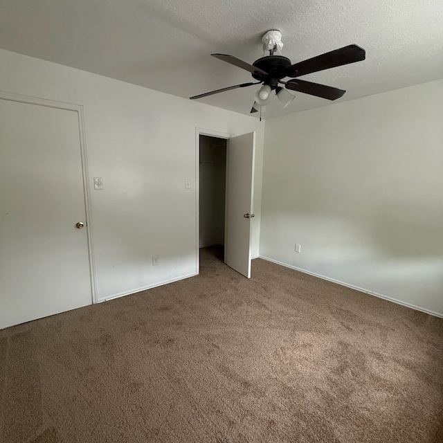 11422 Royal Thistle Ct, Houston, TX 77088 - spare room featuring carpet, a ceiling fan, a textured ceiling, and baseboards
